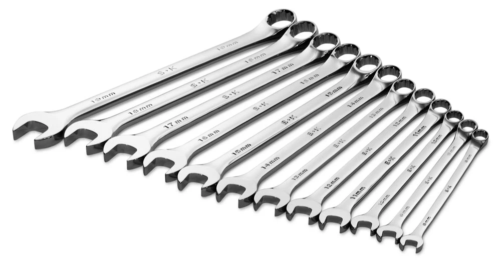 Twelve SK polished metric combination wrenches arranged by size